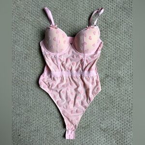 Adorable pink bodysuit with hearts